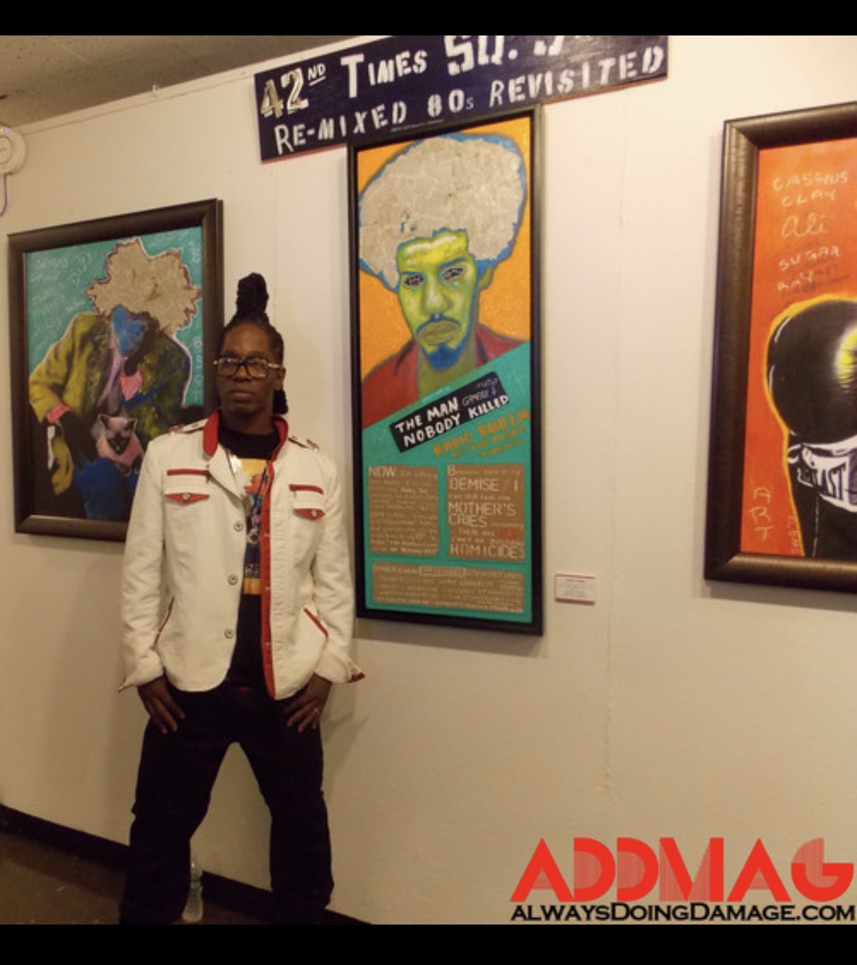 LaRonz Murray in front of art at 42nd Times Square Show